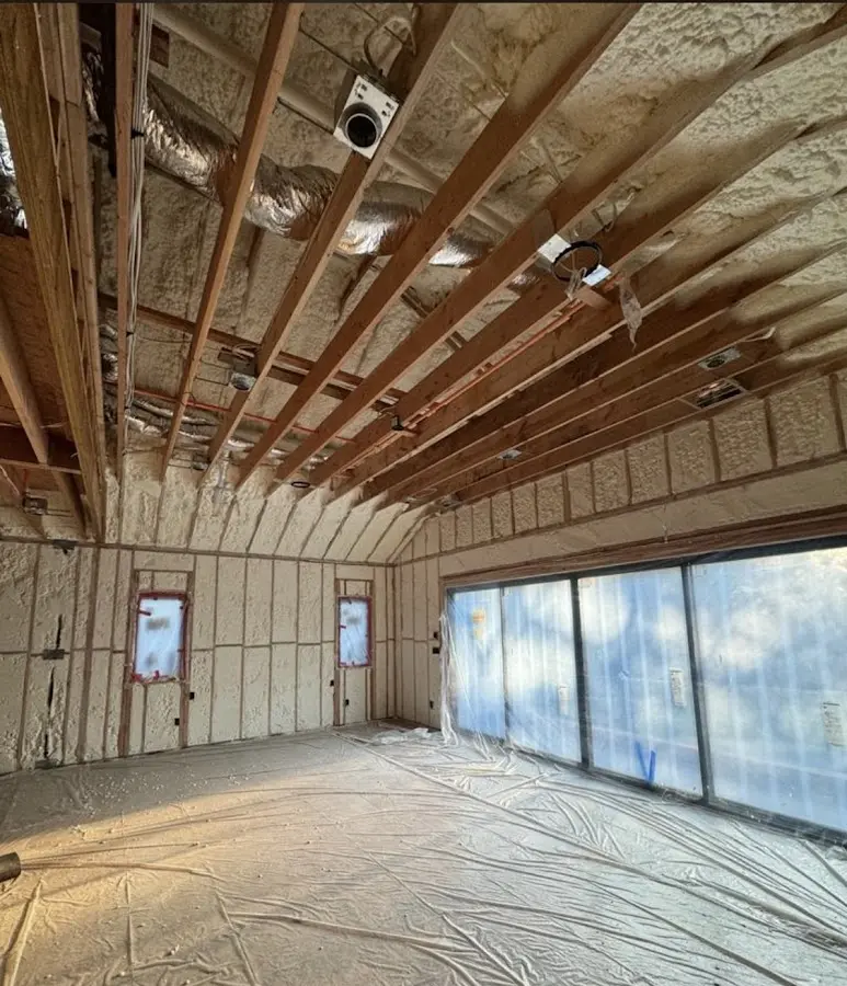 Interior walls and ceiling insulated with spray foam during new construction in East Ridge